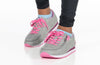 Child wearing grey and fuchsia joggers with pink laces, featuring easy on-off zippers and stylish design for kids.
