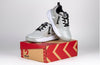 Grey/Black BILLY Sport Court Athletic Sneakers for Kids on a box, featuring easy on/off laces and zipper, functional and fashionable.